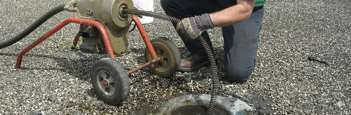 sewer rodding technician actively removing blockages from a sewer line in Fort Wayne, IN